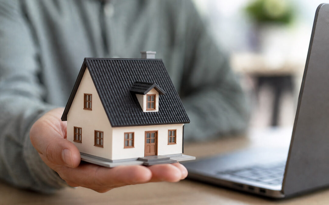 man holding house